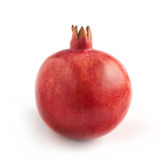 single pomegranate standing on a white background with a soft sh