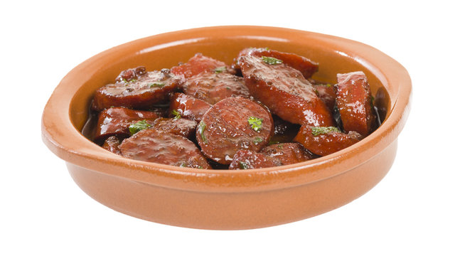 Chorizo al Vino (Spicy sausage cooked in red wine). Traditional Spanish tapas dish.
