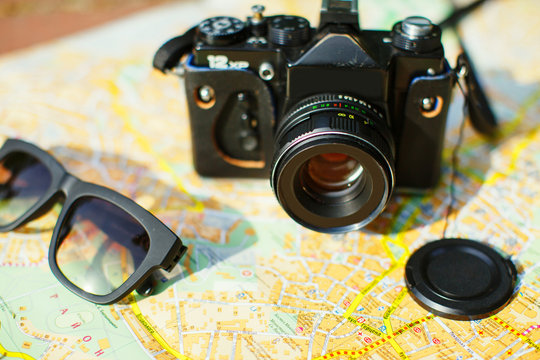  camera and sunglasses on the tourist map
