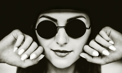 Portrait of young pretty women in black hat
