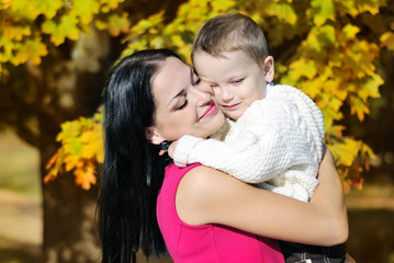 Fototapeta premium little boy with his mother in autumn park