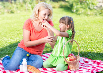 Happy family at summer vacation concept. Mother and daughter