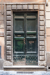 Old dark green wooden door, background