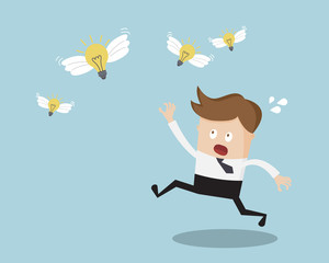 Businessman Running for Catching Bulb Idea