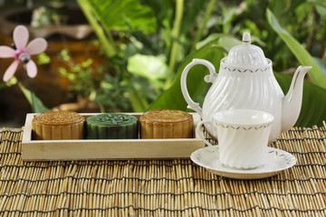 Moon cake on the tray Jug of tea