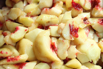 Sliced peaches. Cooking of peach jam or marmalad