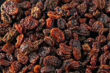 Close up photo of a heap of  raisins or currants