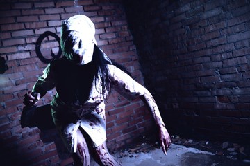 Crazy dead Silent Hill nurse with knife in hand