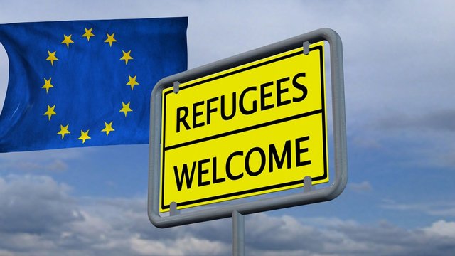 Refugees welcome sign in front of EU flag