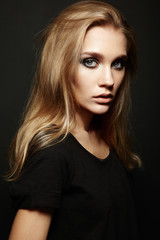 Fototapeta premium Portrait of young beautiful girl with blonde hair