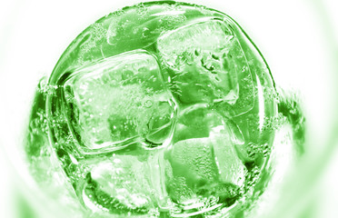 glass of refreshing tropical kiwi lemonade with ice and mint on