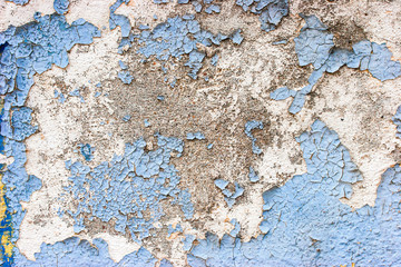 Old  stone wall  with cracked blue  color paint background