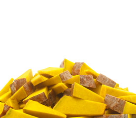 Heap of fresh slice pumpkins isolated on white