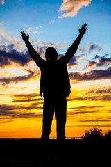 Fototapeta premium Silhouette of Man at the Sunset
