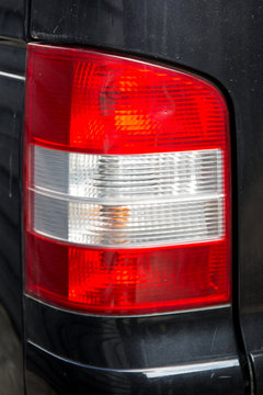 Detail Of The Rear End Of A Silver Car With Focus On The Brake Lights