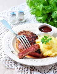 Medium rare grilled Beef steak with mashed potatoes and barbecue sauce