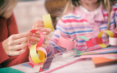 Christmas: Parent and Child Work On Paper Chain Garland