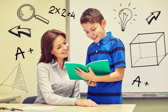 School Boy With Notebook And Teacher In Classroom