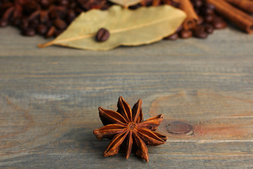 coffee with star anise on wooden background