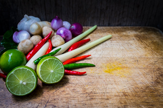 Close up Tom Yum recipe. It consist of Chillies, galangal ginger, lemongrass stalks, kaffir lime leaves and limes.