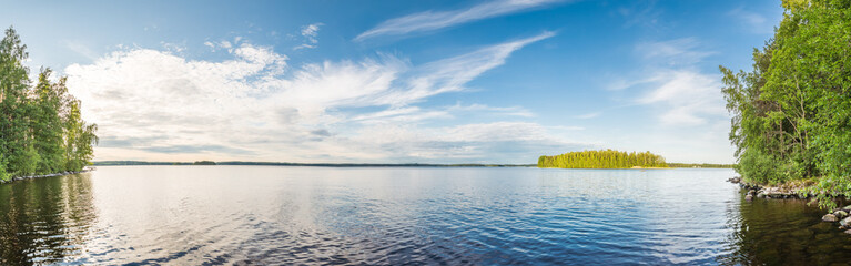 Summer Lake at Calm Day. Wide Angle Panorama Stitched of Several Photos.