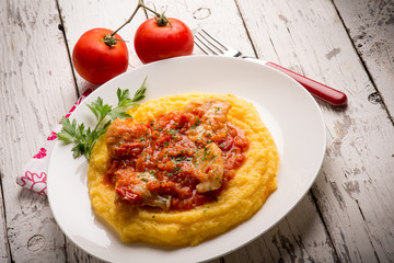 cod with tomato sauce and porridge