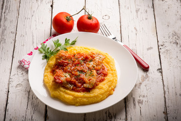 cod with tomato sauce and porridge
