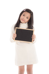 Cute asian girl in white turtleneck dress holding blackboard