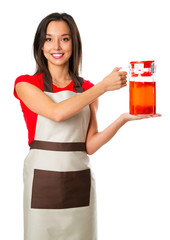 Cheerful woman pouring beverages with fruits at home kitchen