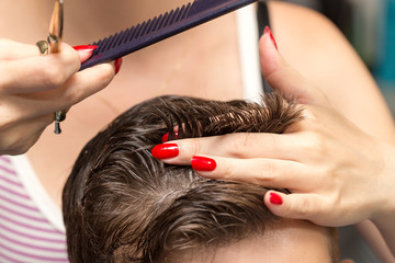 men's hair cutting scissors in a beauty salon