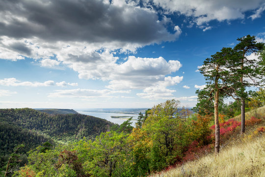 Fototapeta Countryside landscape with mountains and river