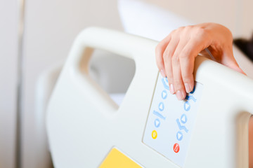 Patient holding his hand on a hospital bed to recover health
