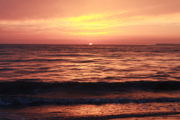 Fototapeta na wymiar Pink sunset over the gorizon, Atlantic ocean. View from Moroccan coast. 