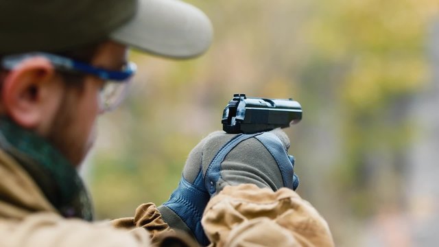 The player fires a BB gun. Airsoft game