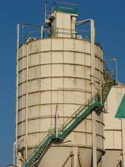 industrial silo with green stairway