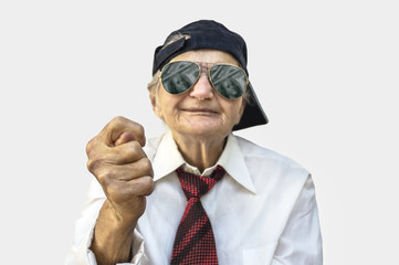 Elderly woman showing fig sign.