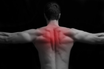 Fototapeta na wymiar Pain in back.Sport injury or another pain concept