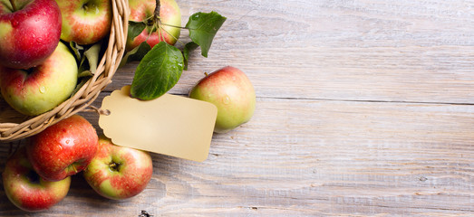 art Ripe red apples on wooden background