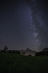 idyllic farmhouse with milky way