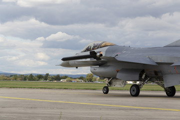 HRADEC KRALOVE, CZECH REPUBLIC - SEPTEMBER 5: Landing F-16 Fighting Falcon with Belgian flag on the CIAF – Czech international air fest on September 5, 2015 in Hradec Kralove, Czech republic.