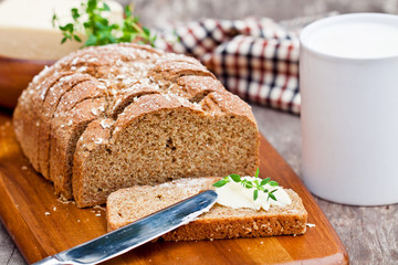 Sliced Irish stoneground soda bread with butter and thyme on the