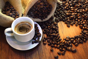 cup of coffee with coffee beans heart shape