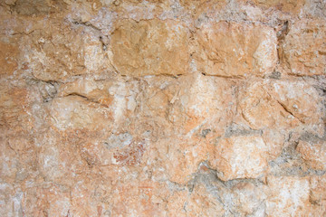 Old, aged and rough orange brick wall texture background.