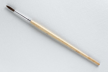 Canvas and paintbrush close-up