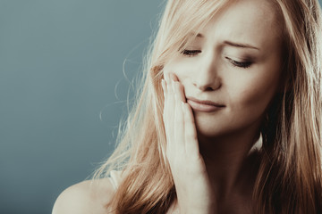 Toothache. Woman suffering from tooth pain