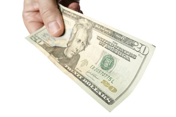 Handing a 20 dollar bill to viewer. The focus is on the near edge of the bill. Isolated on a white...