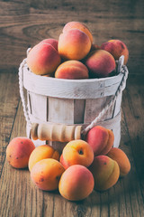 apricots on a dark wood background. toning. selective focus
