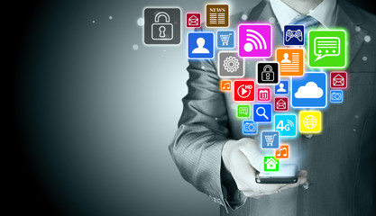 Business man using smart phone with social media icon set