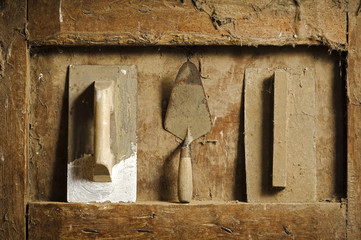 old  hand tools on antique wooden panel