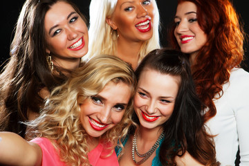 Fototapeta premium Close-up shot of group of laughing girls having party